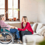 A caregiver helps a senior at home